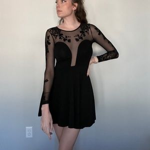 Sheer, long-sleeved black dress